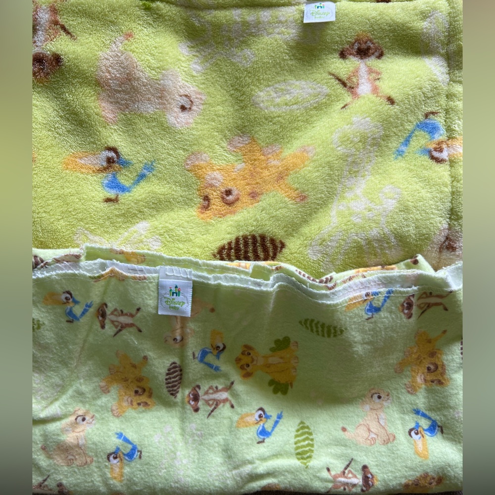 Disney baby Lion King nursery items: blankets and crib sheets.